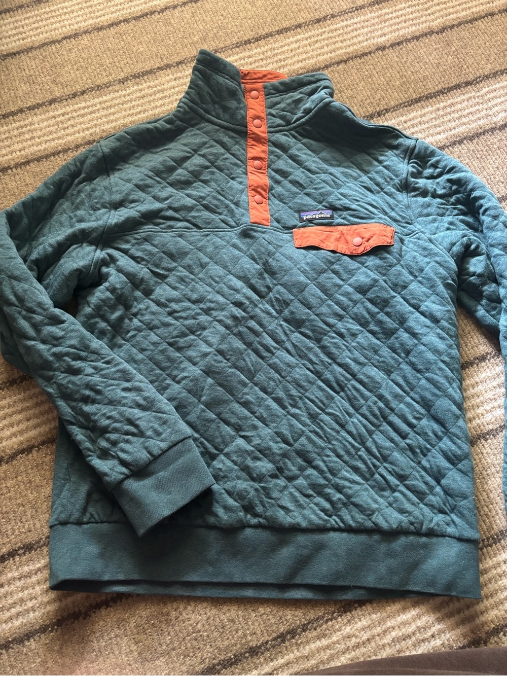Patagonia Quilted Pullover in Teal and Orange
Size Medium
